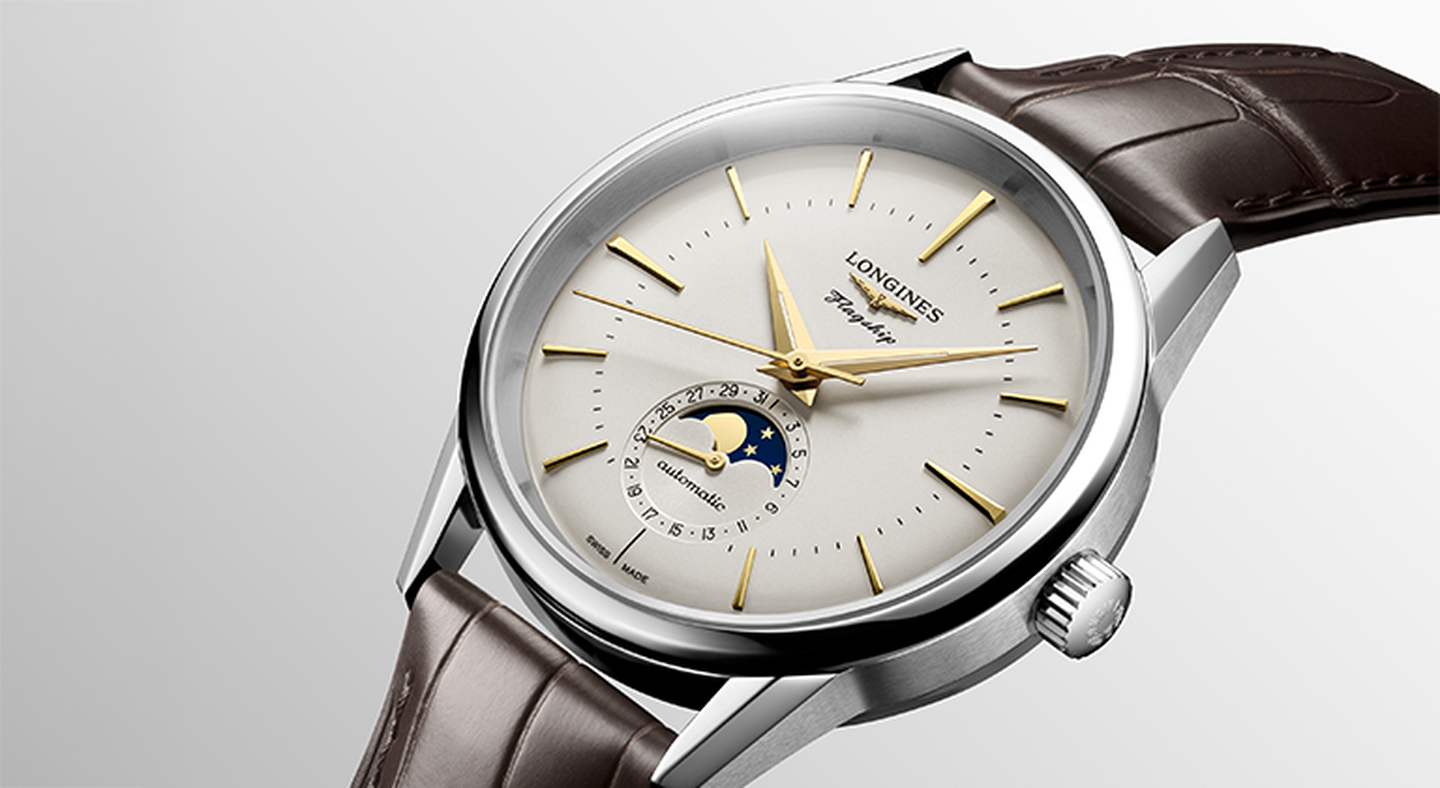 Longines heritage watch on a greige background.